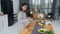 Young woman busy in modern kitchen, attractive girl preparing food