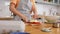 young woman with butter cooking food on kitchen