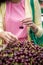 Young woman buying cherries