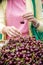 Young woman buying cherries