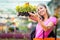 Young woman buying flowers