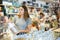 Young woman buying still water at supermarket