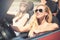 Young woman in cabriolet car departs for the summer holidays