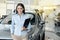 Young Woman in a Car Rental Service Assistant Concept