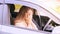 Young woman in car. Ride instruction accident. Automobile loan