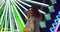 Young woman at carnival stands looking up in awe