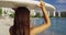 Young Woman Carrying Surfboard On Head At Waikiki Beach