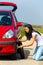 Young Woman Changing Tire