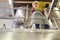 Young woman with checklist in front of a fermentation tank