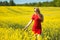 Young woman cheering in the seed field