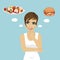Young woman choosing between hamburger and salad. Healthy and junk food concept
