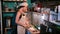 Young woman chopping onion on wooden cutting board