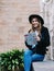 Young woman with city map planning route for walking