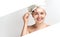 Young woman with clay facial mask. Skincare. Blonde woman smiling on white background. moisturizer mask