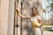 Young woman cleaning the glass surfaces outside