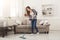 Young woman cleaning house with mop