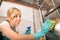 Young Woman Cleaning Inside The Dishwasher