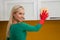 Young woman cleaning kitchen