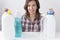 Young woman and cleaning products