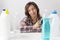 Young woman and cleaning products