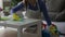 Young woman cleaning the table close-up