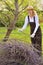 Young woman cleaning tree limbs