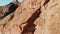 Young woman climbing on the high rock