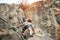 Young woman climbing a rock wall in a canyon - Strong climber training outdoor - Travel, adrenaline and extreme dangerous sport
