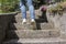 Young woman climbs on stairs