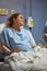 Young woman in clinic bed