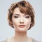 Young woman close up face beauty portrait.Short Hair style. Fem