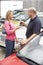 Young woman collecting new car