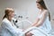 Young woman is consulted by a gynecologist at medical center