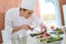 Young woman cook preparing appetizers