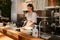 Young woman cook preparing meals for a restaurant in kitchen