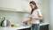 Young woman cooking meal at home kitchen.