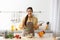 Young woman cooking tasty soup