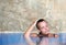 Young woman cools off in pool