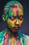 Young woman covered with a colourful paint