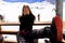 Young woman covered his face with her hands with mountain view during ski vacation in Alps backgrounds