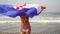 Young woman with croatia flag on the sea. Girl with Croatian flag on the beach