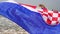 Young woman with croatian flag on the sea beach, slow motion. Tourism in Croatia