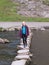 Young woman crossing stepping stones sovedale