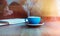 Young woman with cup of coffee at home. Visual effects. Blurred background.Cropped.