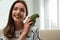 Young woman with cute Alexandrine parakeet