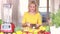 Young woman cutting banana into slices