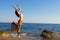 Young woman dance in the beach