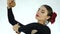 Young woman is dancing traditional Spanish dance. flamenco dancer on a light background. slow motion