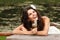 Young woman with dandelions summer outdoor, beautiful bride has