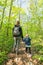Young woman with daughter on hike in the vernal forest